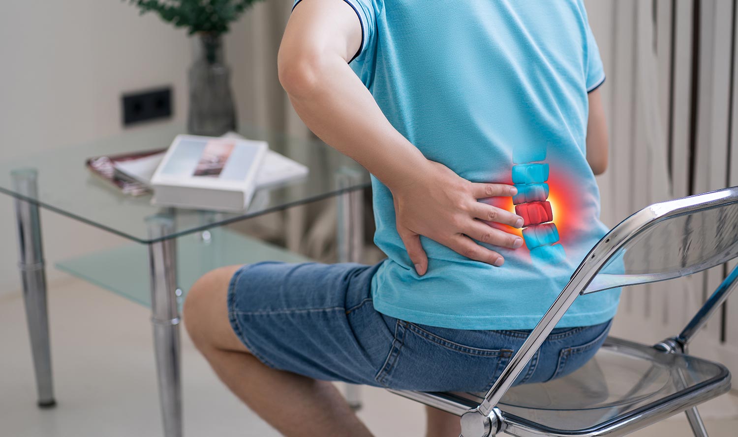 A male patient, who was seated on a chair due to chronic lumbar discomfort, engaged the expertise of a neurosurgeon in consultation for potential interventions.