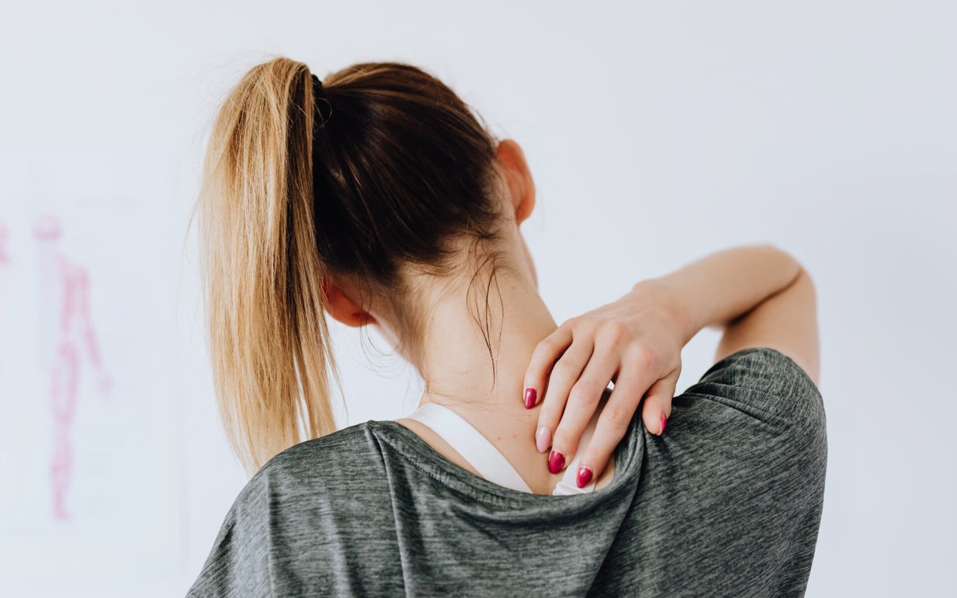 A female patient presents experiencing neck and back pain.